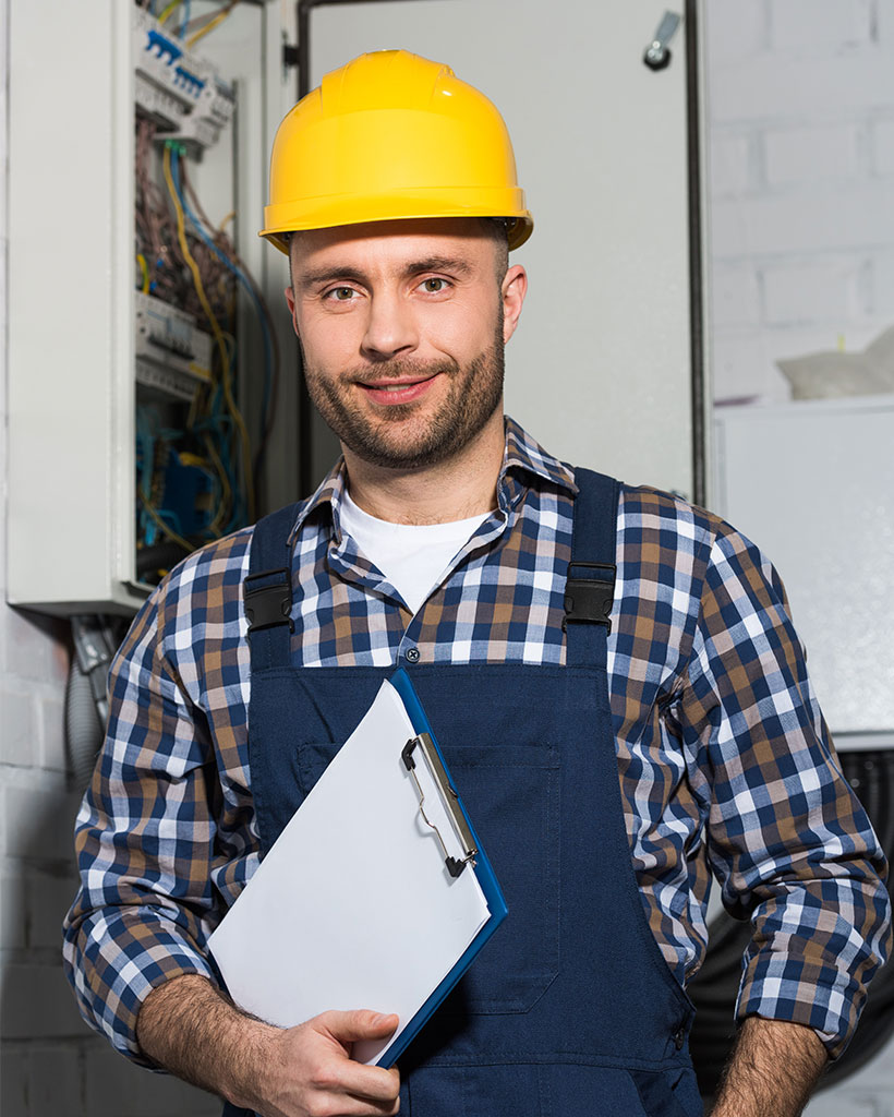 electrician-holding-clipboard-and-smiling-by-elect-JZP244K.jpg